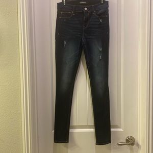 Express stretch mid-rise leggings. Dark blue jeans. Size 2R